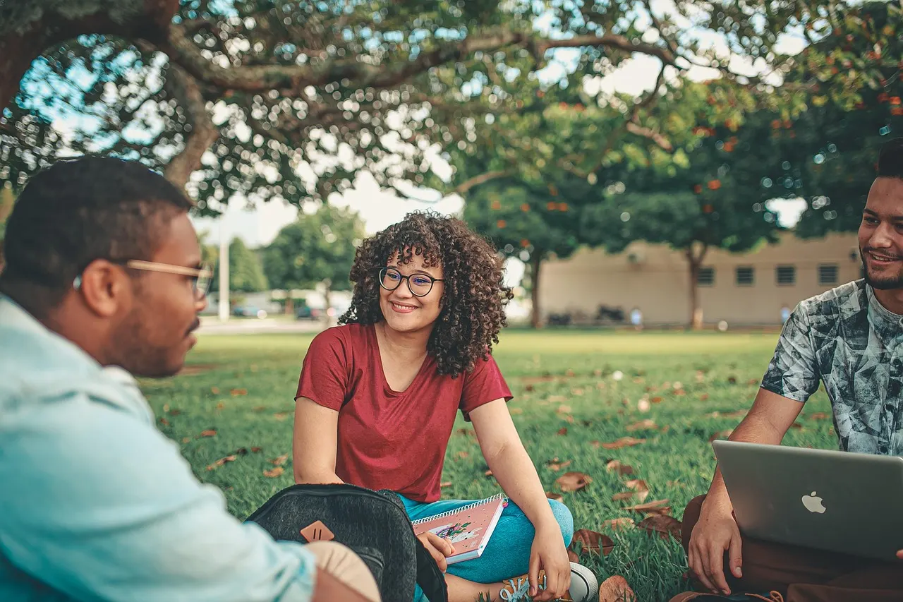 Diverse group of young adults walking together on a university campus