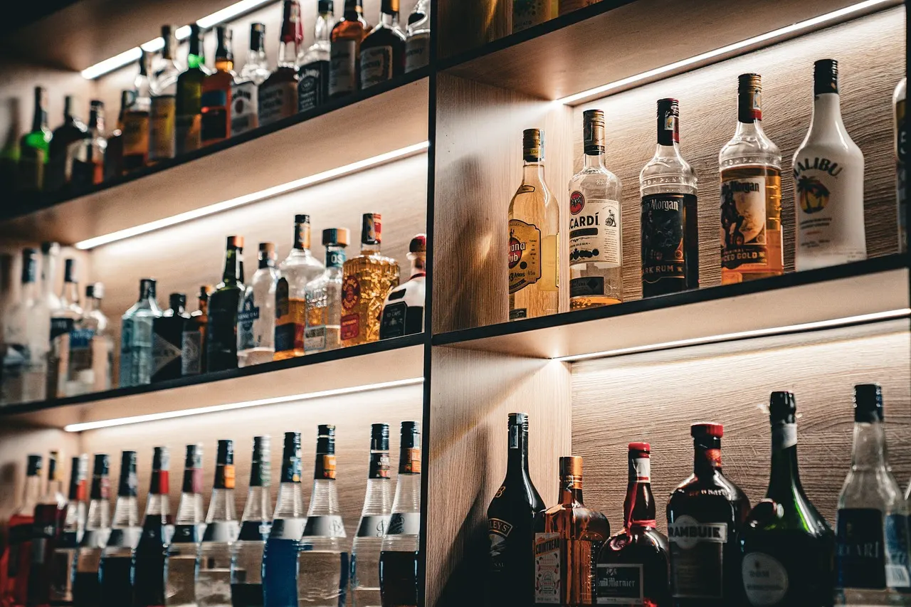 Liquor store shelves stocked with wine and spirits bottles