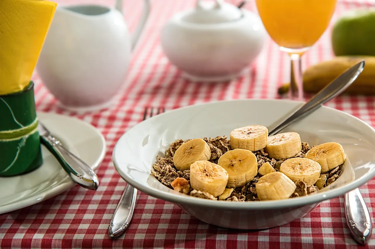 DASH diet breakfast bowl with oatmeal, banana and low-fat milk