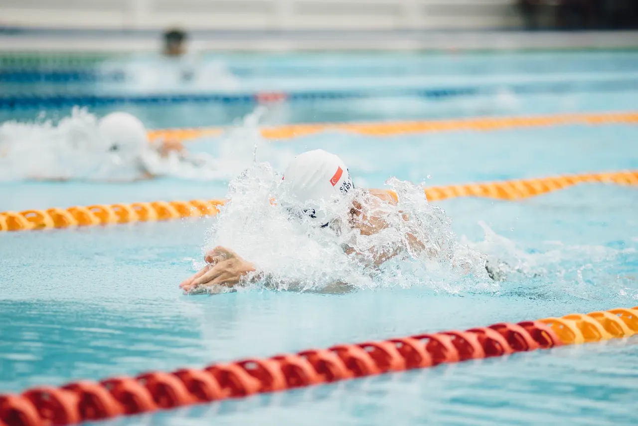 Athletes drinking water during summer training