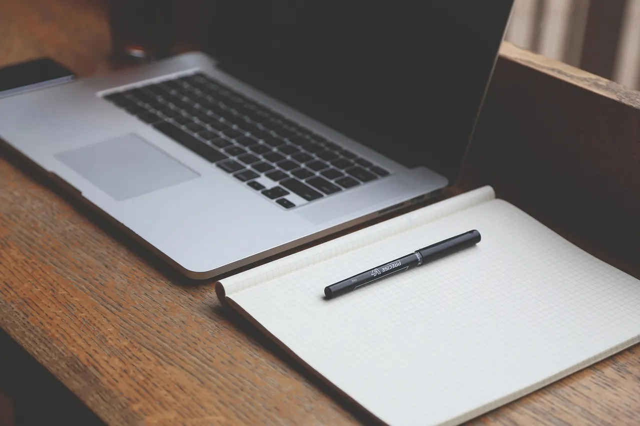 Person calculating personal finances at a desk