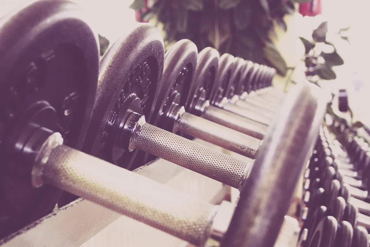 training each muscle group twice a week with dumbbell rows at home