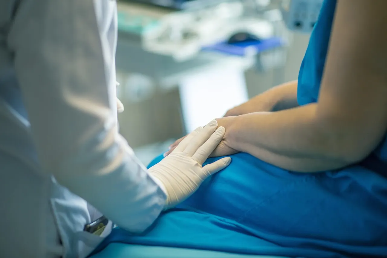 Doctor consulting with a female patient about medical chart