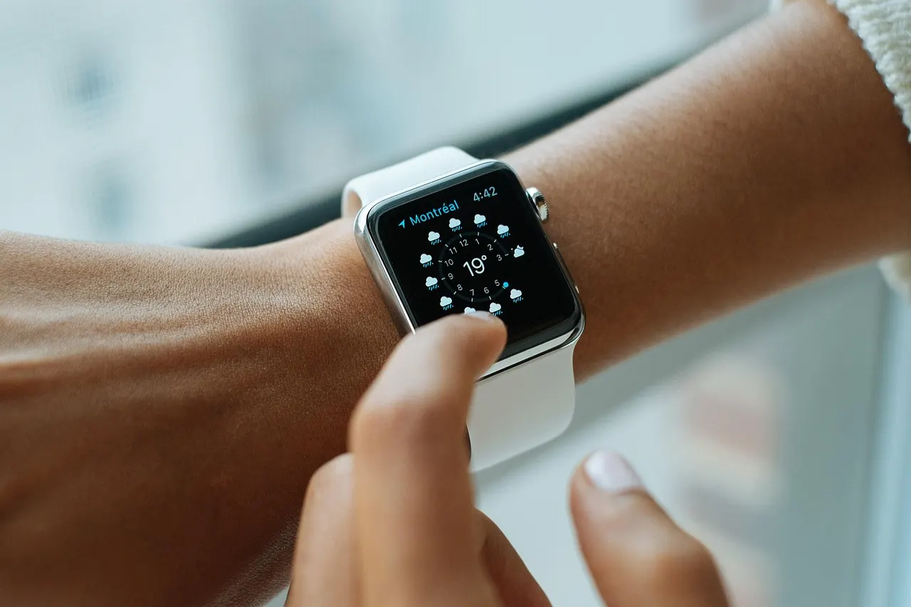 Smartwatch displaying heart rate zone 2 tracking during a run