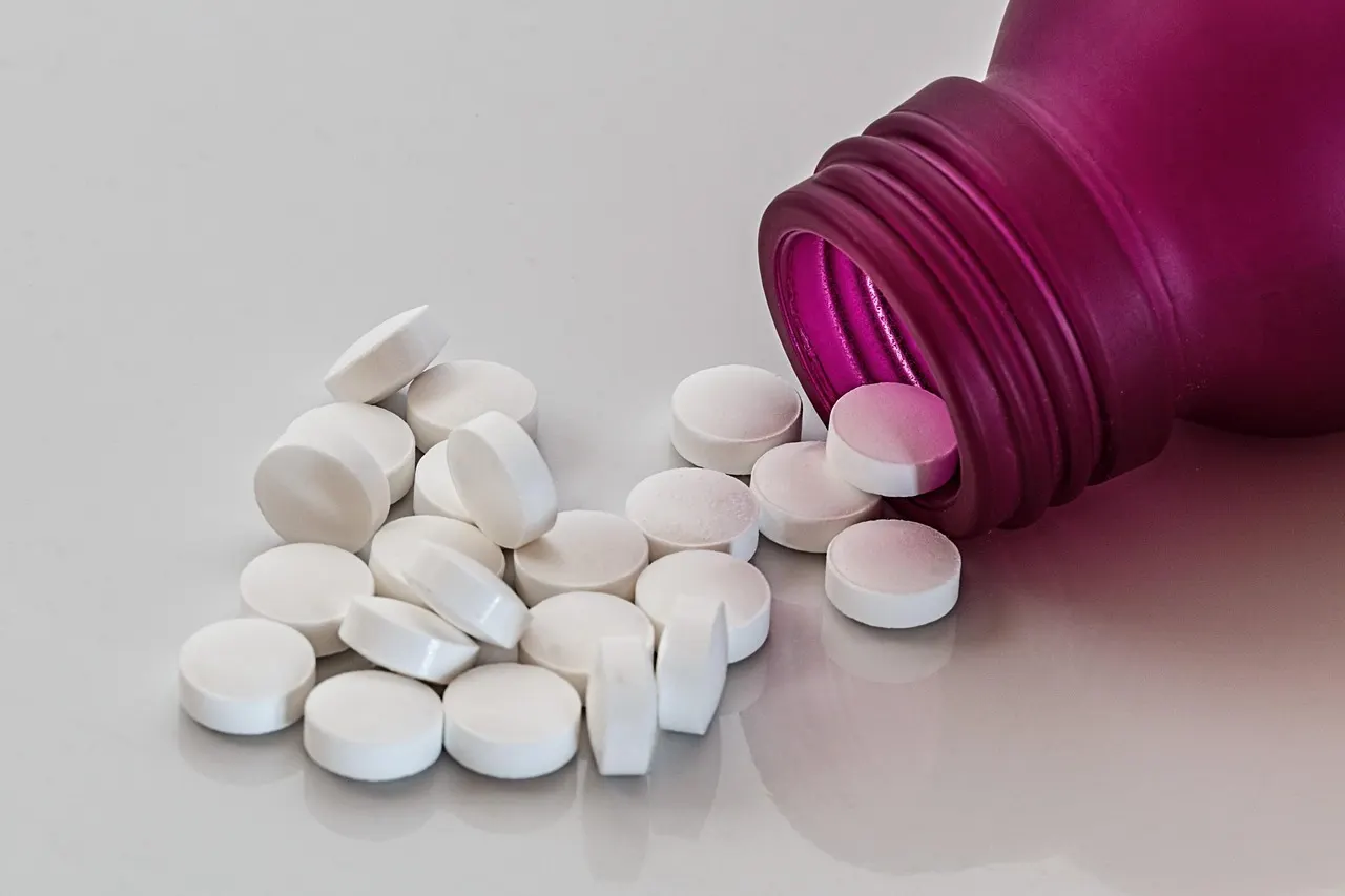 Hands holding a prescription pill bottle for antidepressants