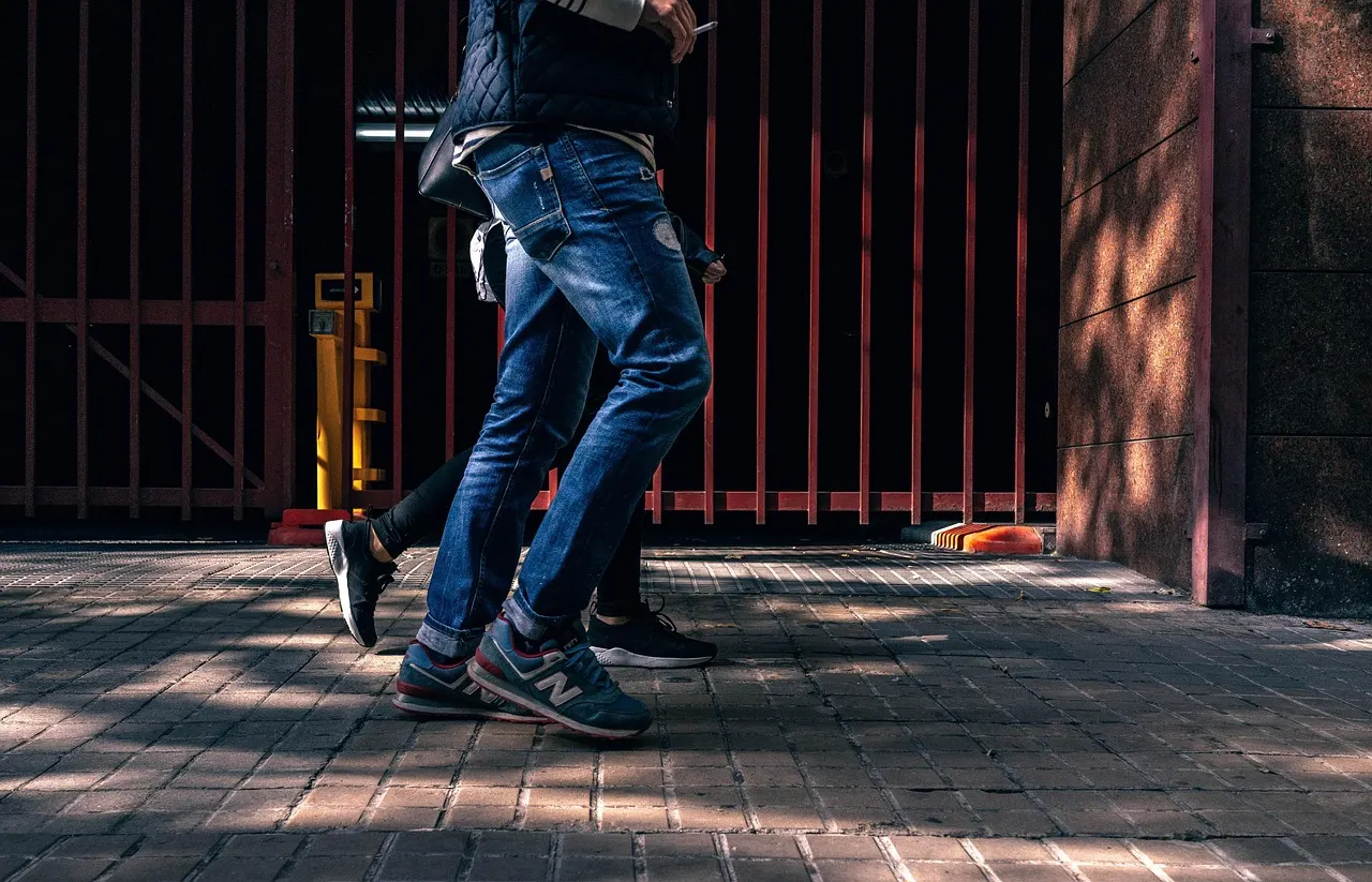 Close up of a person walking briskly outdoors, representing daily moderate exercise