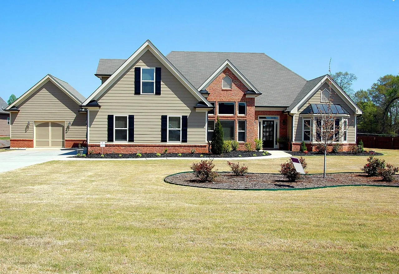 A row of suburban houses with real estate for sale signs