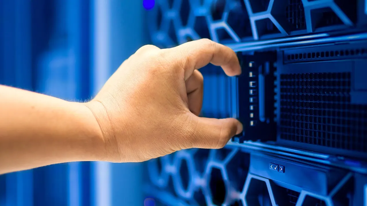 Rows of data center servers representing massive AI infrastructure investment